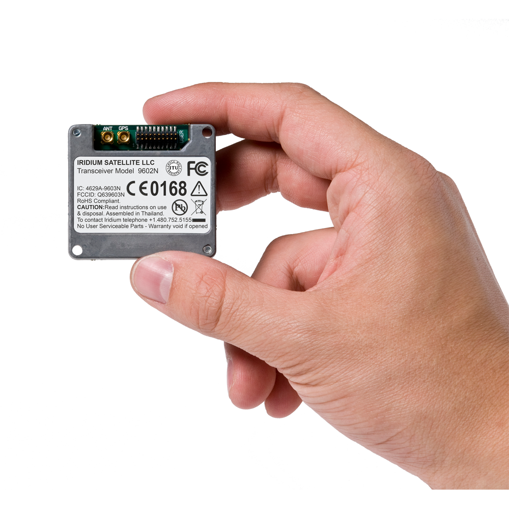 Iridium 9602N SBD transceiver shown in hand for size reference